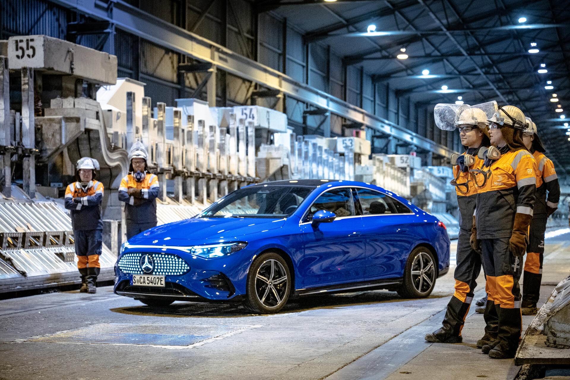 a group of people standing next to a car