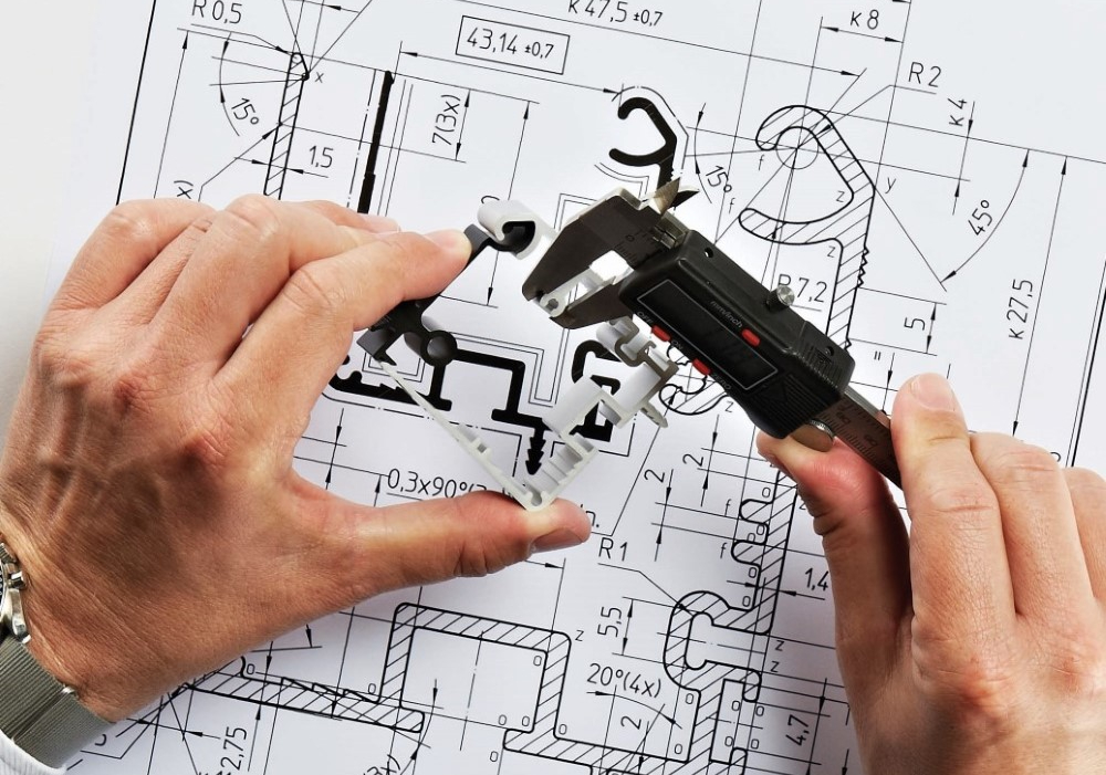 An engineer designing an extrusion profile.