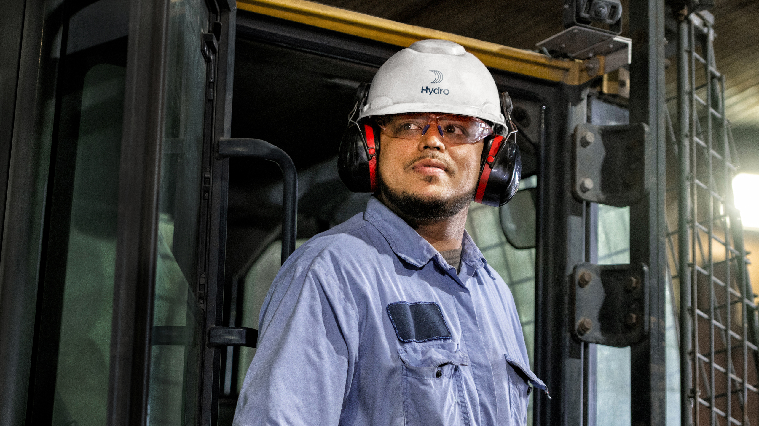 a man wearing a hard hat and earmuffs