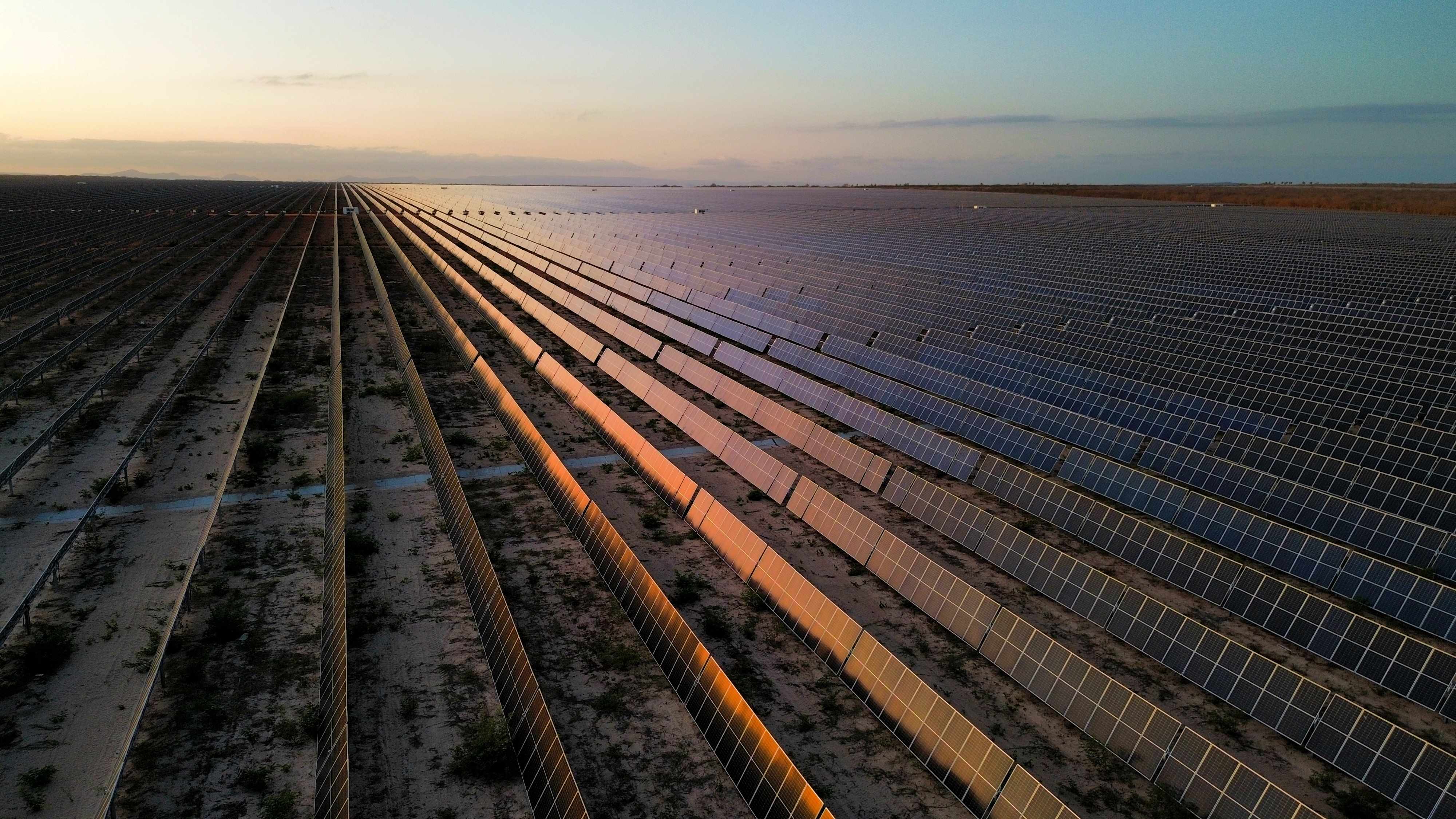 a road with rows of solar panels