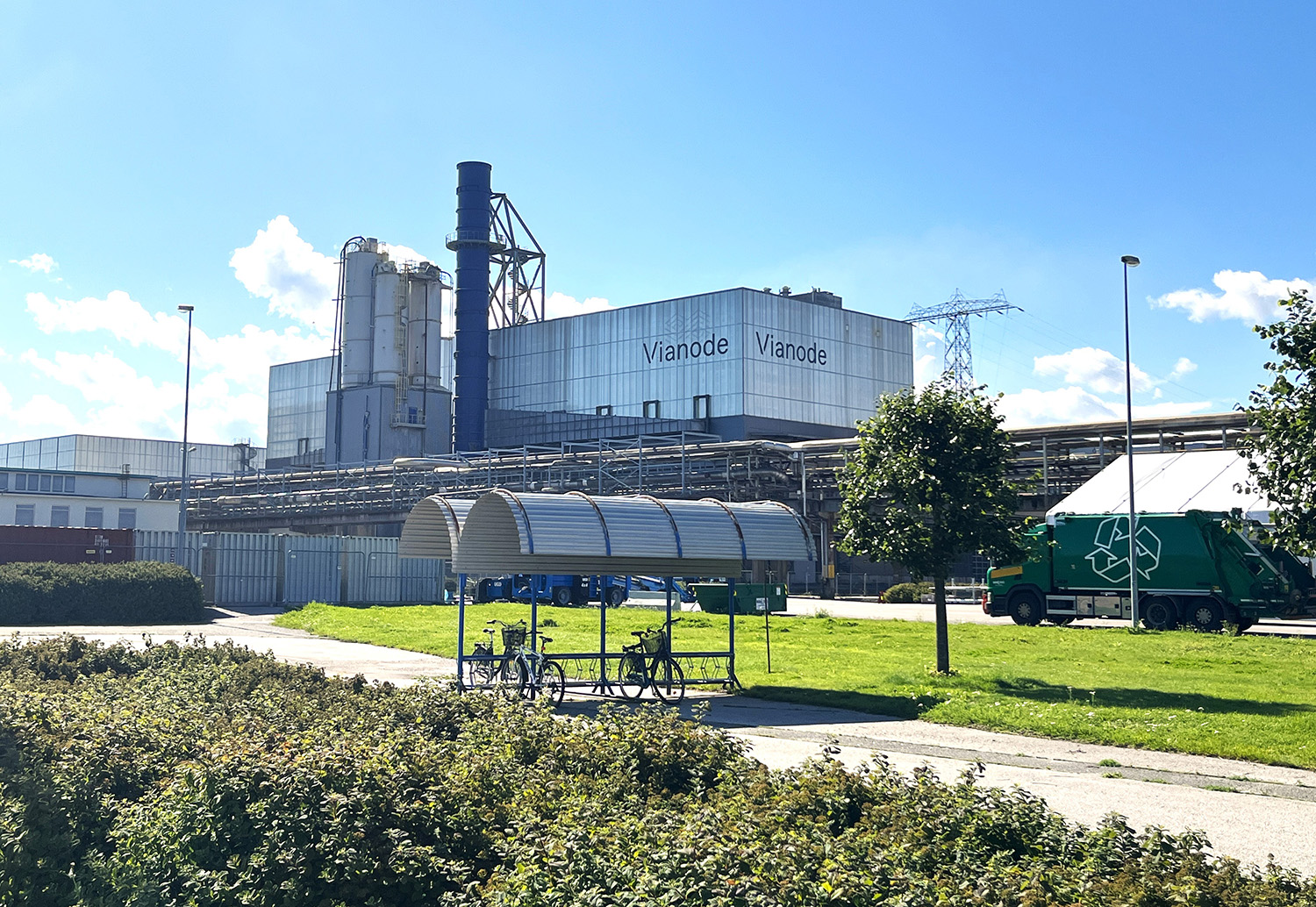 a large building with a green lawn