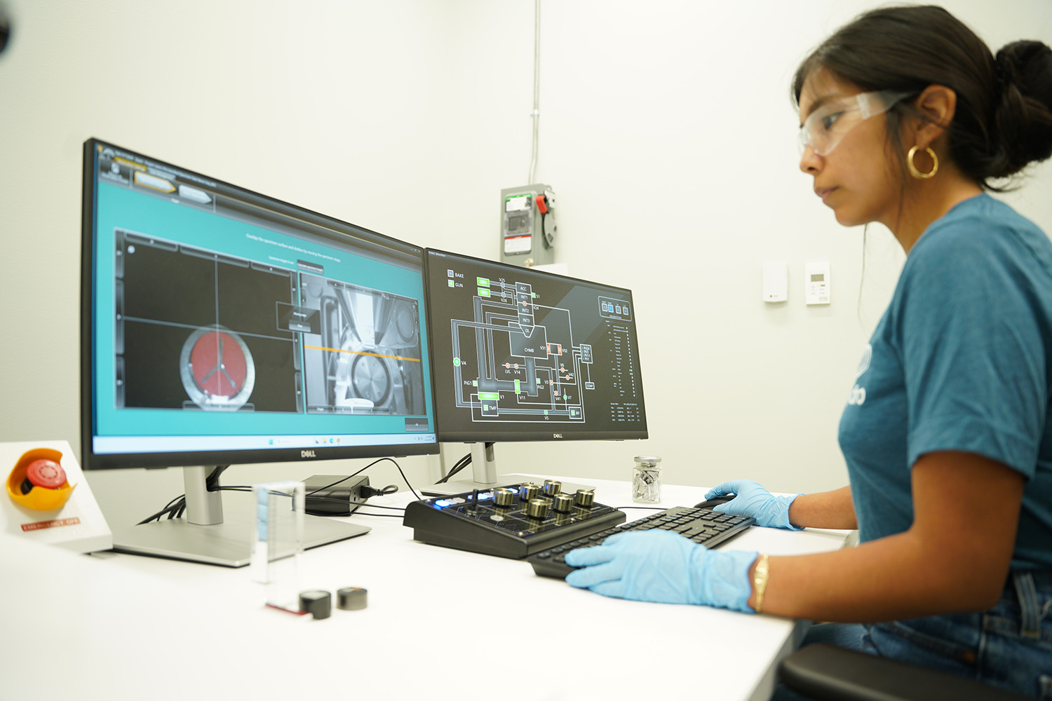 a person in a blue shirt working on a computer