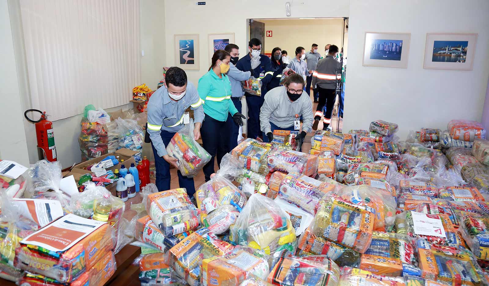 a group of people standing in a room full of boxes