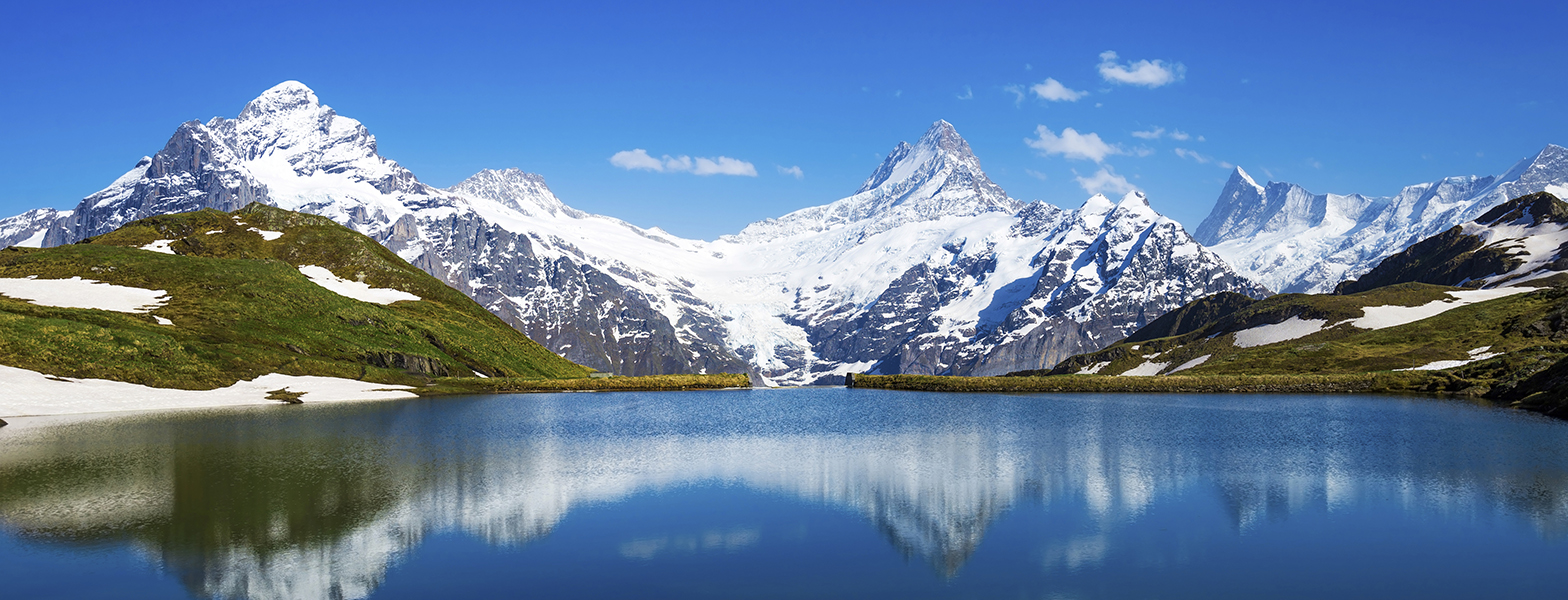 snow covered mountains and a lake