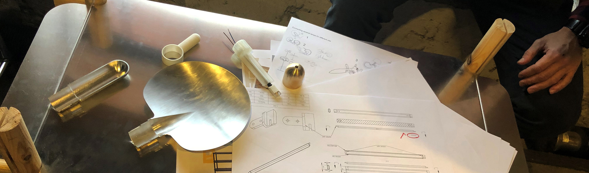 Aluminium table with technical drawings