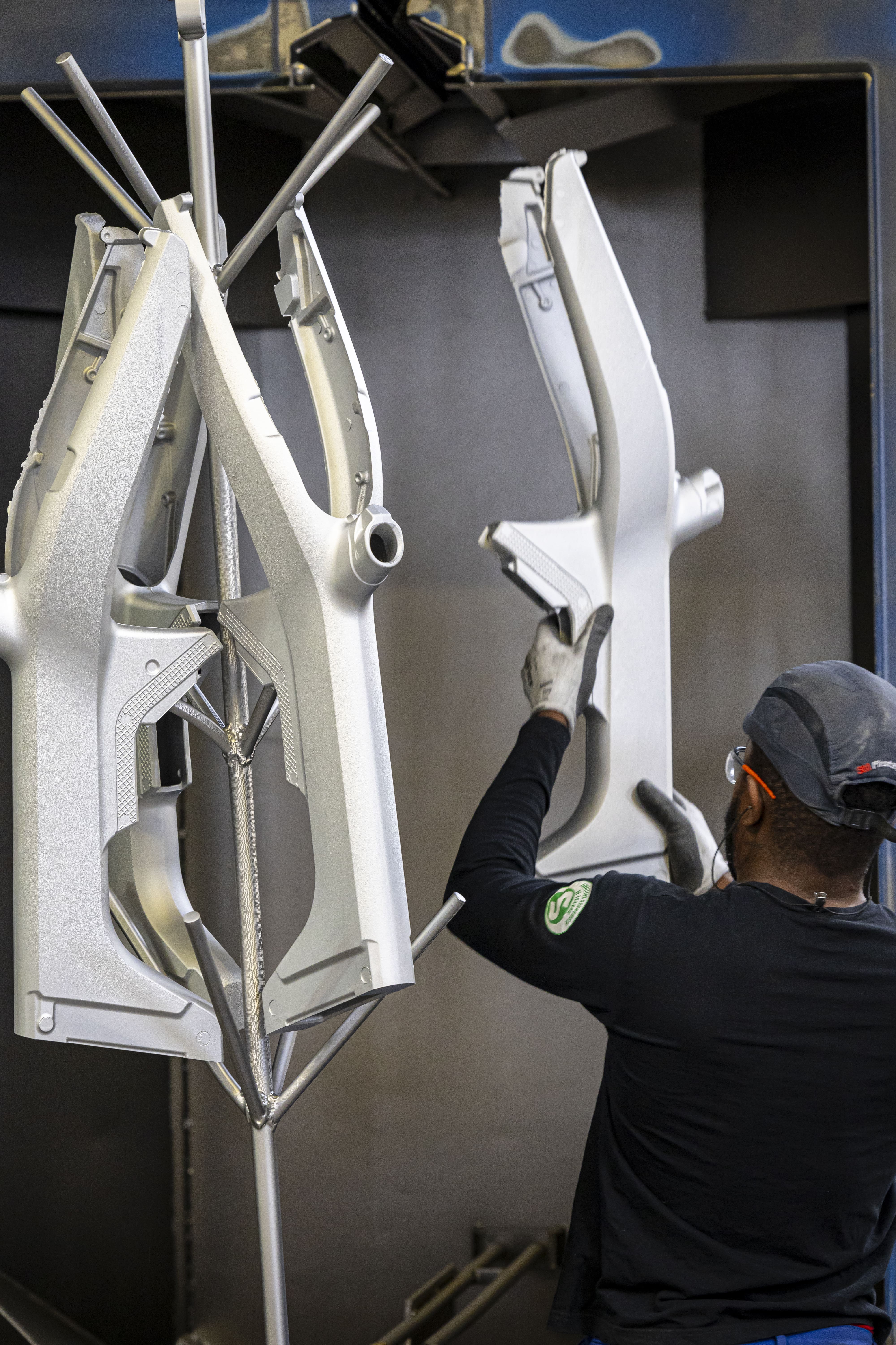 a person holding a large piece of machinery